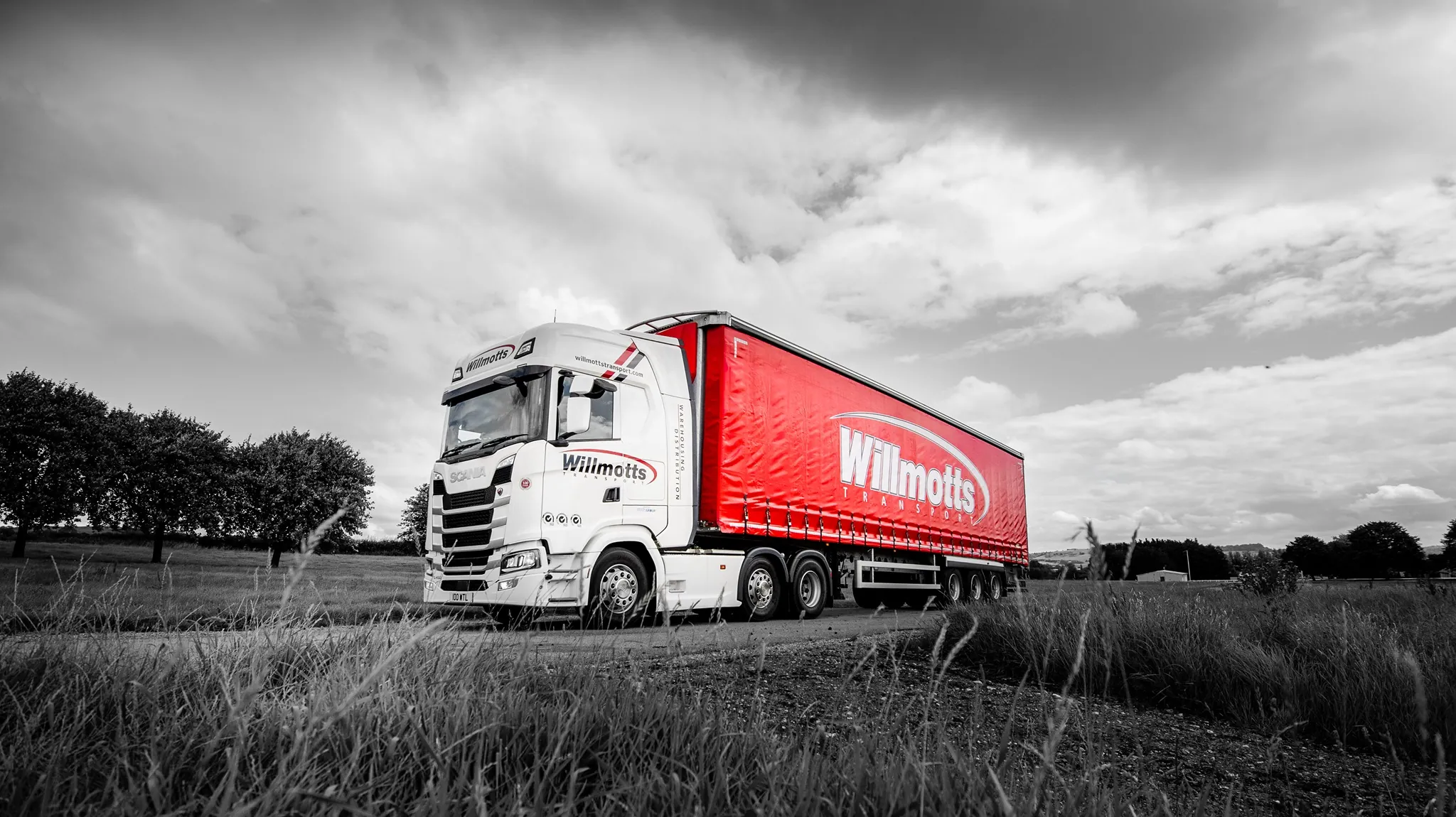 Red Willmotts Transport lorry in the countryside